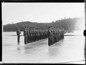 Military contingent with rifles and bayonets, perhaps at RNZAF base, Hobsonville