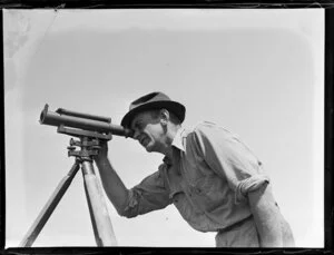 Royal New Zealand Air Force base, Hobsonville, man with theodolite