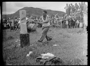 Unidentified men paricipating in a wood chopping contest, Coroglen, Thames-Coromandel District