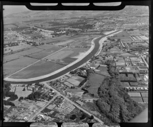 An aerial view of Burwood Primary School, including the construction of New Brighton Road and Avonside Drive, Christchurch