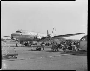 Passengers luggage being loaded onto the New Zealand National Airways Corporation aircraft