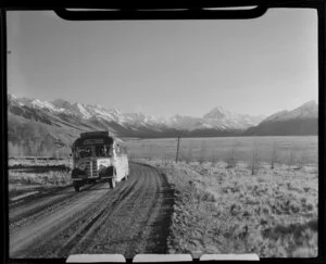 Mount Cook & Southern Lakes Tourist Company Ltd bus, with Mount Cook in background