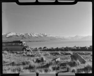 View of Lake Pukaki, with Mount Cook & Southern Lakes Tourist Company Ltd bus