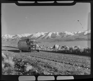 Lake Pukaki with Mount Cook & Southern Lakes Tourist Company Ltd bus, and mountains