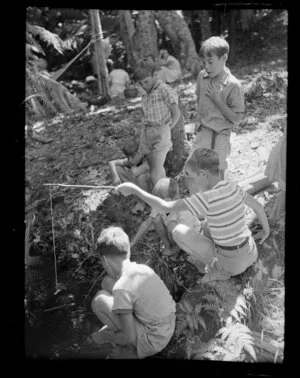 Unidentified group of boys playing by the stream, Maraetai, Auckland