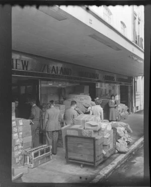 Freight on the footpath at New Zealand National Airways Corporation Auckland office.