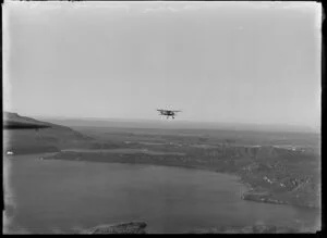 A WACO aircraft operated by Blackmores, over the Rotorua lakes