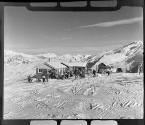 Happy Valley Chalet with skiers getting ready for skiing on Coronet Peak, Otago