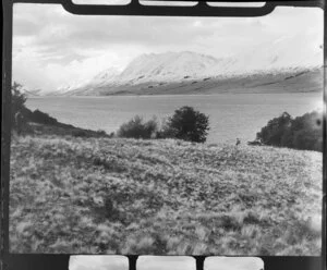 Lake Ohau, Waitaki County, with snow covered hills behind