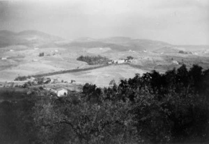 A view of an area taken from no 16 Pl position by the 22nd Battalion showing a monastery at the end of the line of cypress trees with La Romola to the right