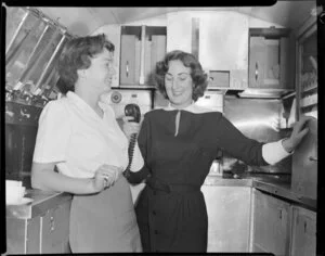 Pan American World Airways, stewardess and passenger in galley of Boeing 377 stratocruiser, Clipper Rainbow