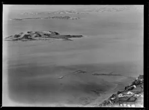 View to Browns Island (volcanic) within the Hauraki Gulf, Auckland City, over Riddell Road with residential houses and Karaka Bay, to Motuihi Island and Waiheke Island beyond