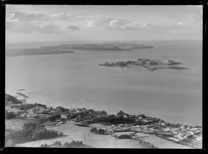 View to Browns Island within the Hauraki Gulf, Auckland City, over Riddell Road with residential houses and Churchill Park (foreground) and Karaka Bay, to Rangitoto Island and Motutapu Island beyond