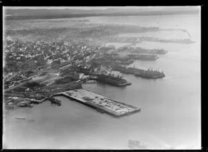 Auckland City water front, showing new wharf area under construction with ships at other wharfs, view to city center and Westhaven Marina and Ponsonby, with the inner harbour beyond
