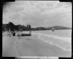 Stanmore Bay, Whangaparaoa Peninsula, showing people and boats at the beach