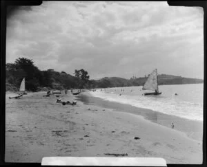 Stanmore Bay, Whangaparaoa Peninsula, showing people and boats at the beach