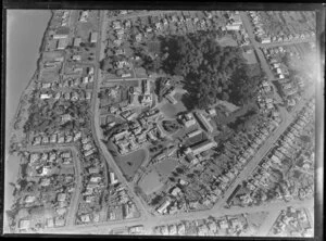 Close-up view over Wanganui Public Hospital, surrounded by residential housing with Tawa Street and Koromiko Road and Heads Road, and the Wanganui River looking southwest