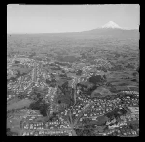 View over New Plymouth outer residential area, Taranaki District, looking inland to Yarrow Park and Frankley Road and Carrington Street, to farmland and Mount Taranaki beyond