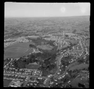 New Plymouth, Taranaki District, showing residential housing with racecourse and Pukakura Park with lakes, Victoria Road and Carrington Street, with farmland beyond