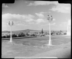 Lamps outside the Auckland War Memorial Museum, including Rangitoto Island in the distance