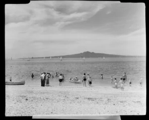 Mission Bay and Rangitoto Island, Auckland, showing bathers and people on beach