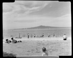 Mission Bay and Rangitoto Island, Auckland, showing bathers and people on beach