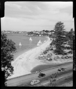Mission Bay, Auckland, showing yachts, people and cars parked on the grass area
