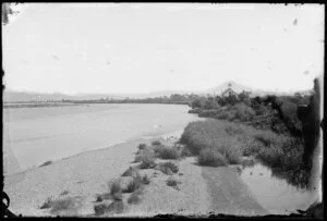 River, with a wooden building [schoolhouse? church?], on riverbank in distance, probably Hutt Valley