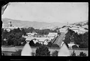 View from Thorndon, Wellington, showing houses, Government House at left, and Lambton Harbour in distance