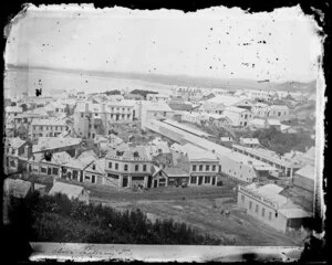 Dunedin with Rattray Street in foreground, showing houses and commercial buildings including D White's Crown Hotel, 'Skakspeare' Hotel, and the Steam Packet Dining Rooms - Photograph taken by W Meluish
