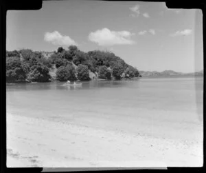Beach scene, including men in row boat, net fishing, Mita's Island, Bay of Island