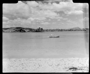 Beach scene, including men in row boat, net fishing, Mita's Island, Bay of Island