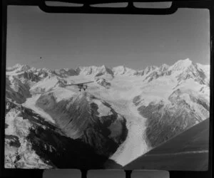 Mount Cook and Southern Lakes aircraft, Auster ZK-BOX in flight over Fox Glacier region, Southland