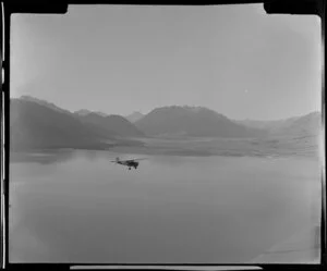 Mount Cook and Southern Lakes aircraft, Auster ZK-BOX in flight over Lake Ohau, Southland