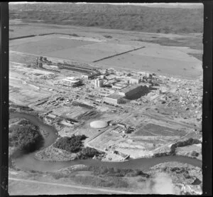 Kawerau, Bay of Plenty, showing Tasman Pulp and Paper Mill under construction, with farmland beyond