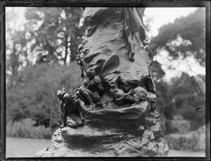 Oamaru Gardens, Otago, view of Wonderland statue of two boys by the sculptor Thomas Clapperton, closeup of fairies around base