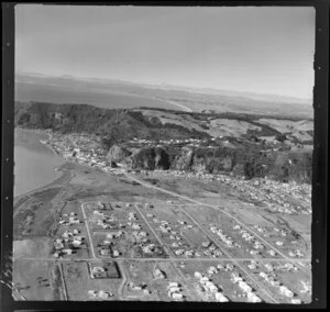 Whakatane, Bay of Plenty, showing view to Whakatane River mouth with tidal flats and Kohi Point with Peace Street and The Strand road with housing settlements, with view to Ohope and the East Cape beyond