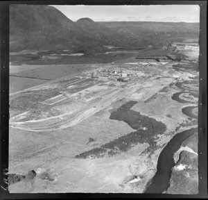 Kawerau, Bay of Plenty, showing Tasman Pulp and Paper Mill under construction with Lake Pupuwharua and Mt Edgecumbe beyond