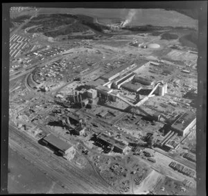 Kawerau, Bay of Plenty, showing southern end of the Tasman Pulp and Paper Mill under construction, with rail depot and workers housing