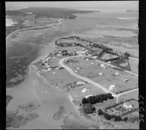 Bowentown, Tauranga, Bay of Plenty, showing view of a peninsula with tidal flats, northern section of Tauranga inner harbour, with housing along Athenree Road and Roretana Drive, looking out to Bowentown Heads and harbour entrance beyond