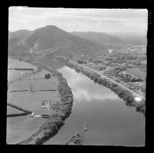 Taupiri, Waikato, showing township on the banks of the Waikato River and Great South Road (State Highway 1), Mangawara Stream merging with the Waikato River next to Mt Taupiri beyond