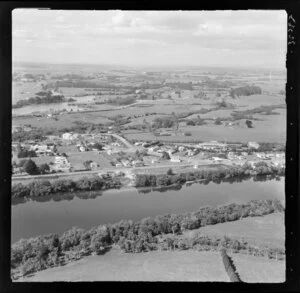 Taupiri, Waikato, view of township on the banks of the Waikato River with the Great South Road (State Highway 1), residential housing and primary school with farmland and Mangawara Stream beyond