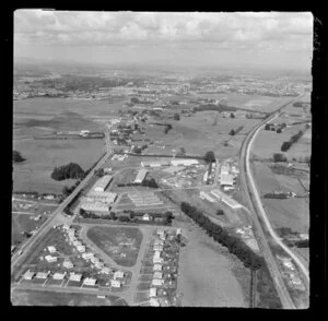 Te Rapa, Waikato, showing Air Force Camp with training grounds and housing between Te Rapa Road (State Highway 1) and railway line, looking south to the racecourse and Hamlton beyond