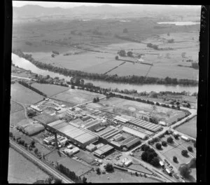 Horotiu, Waikato, showing AFFCO Freezing Works next to the Waikato River and Great South Road (State Highway 1) with farmland beyond