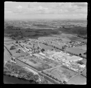 Horotiu, Waikato, showing AFFCO Freezing Works next to the Waikato River and Great South Road (State Highway 1) with farmland beyond