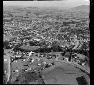 Te Awamutu, Waikato, view west with Ohaupo Road intersecting Bond Road with Arawata Street with church and housing, to farmland beyond