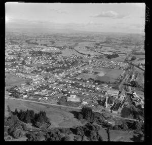 Te Awamutu, Waikato, view over dairy company next to housing, Alexander Street and Te Awamutu College, with farmland beyond