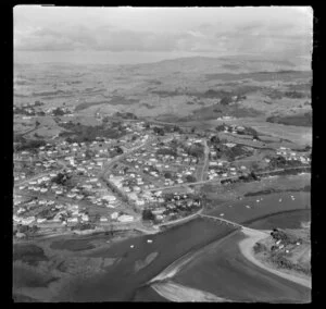 Raglan, Waikato, view of Wainui Stream tidal estuary and bridge with Wainui Road, Cliff Street and Bow Street (State Highway 23), housing with farmland beyond
