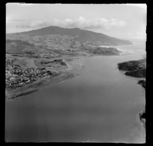 Raglan, Waikato, view along the coast to the mouth of Raglan Harbour and Raglan Township, with farmland and Mt Karioi beyond