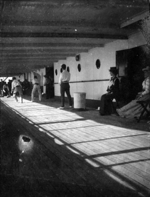 Men playing cricket on board ship